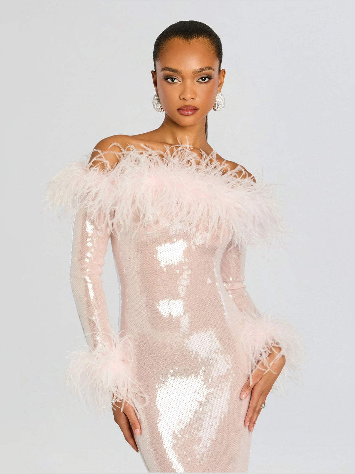 Pink sequin midi dress with feathered off-shoulder trim and long sheer sleeves