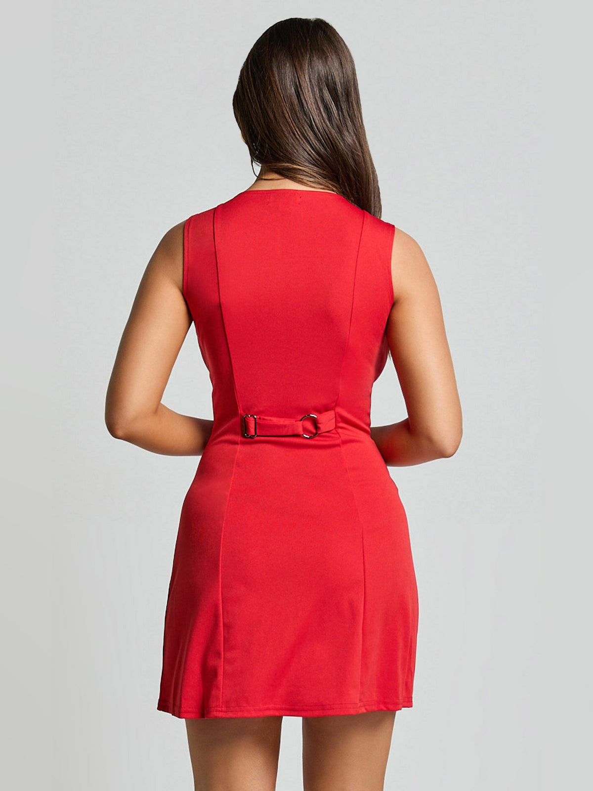 Red sleeveless mini dress back view with center seam and waist belt detail