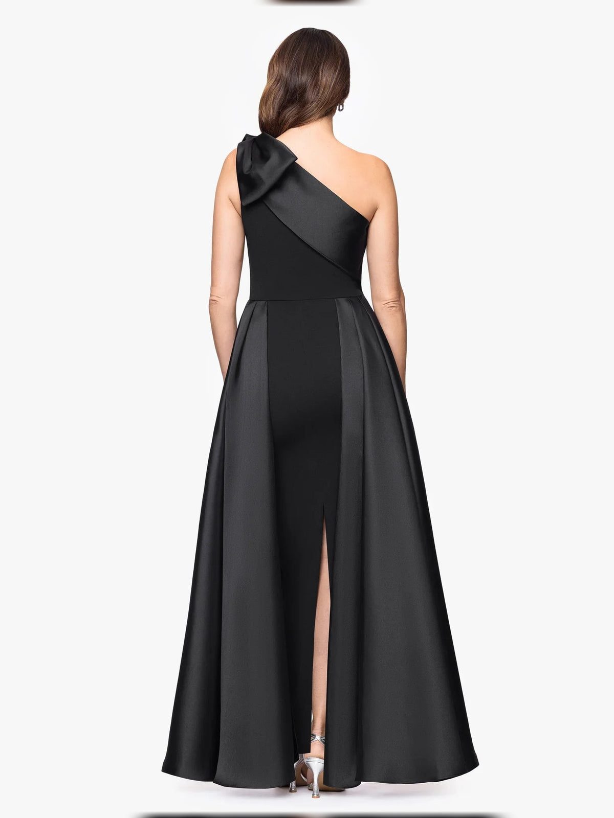 Black one-shoulder sheath dress with bow detail at shoulder and back slit, floor-length