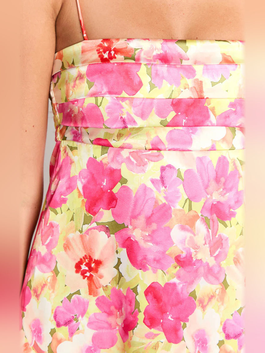 Close-up floral fabric print in pink, yellow, and white for a mini dress