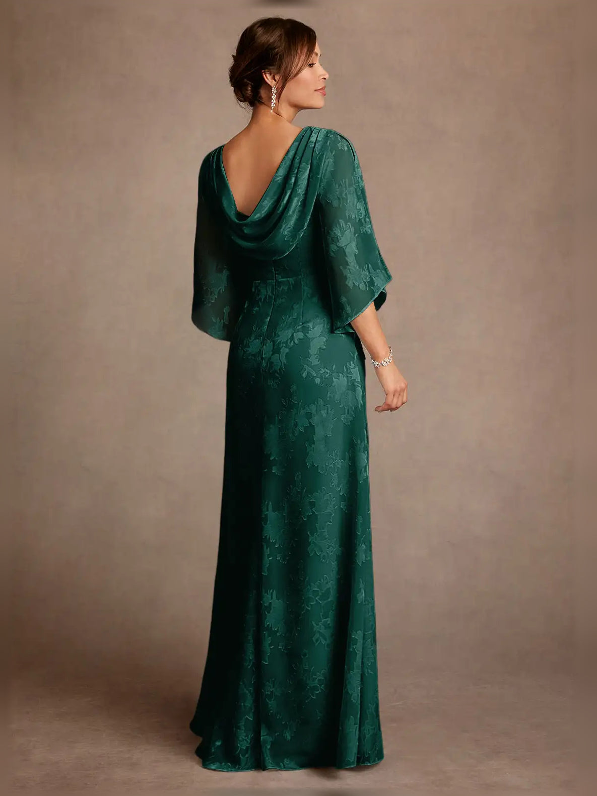 Peacock green draped column dress with bateau neckline and three-quarter cape sleeves