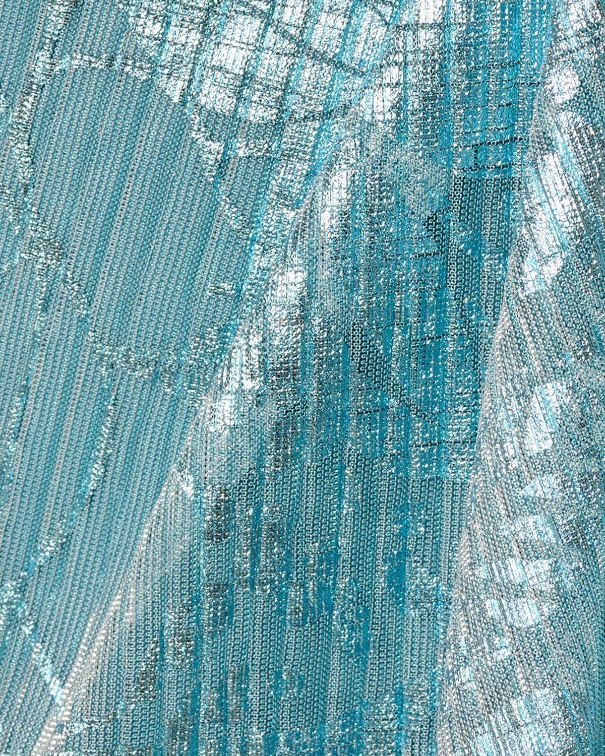 Teal floral print fabric with shimmering texture, close-up of dress material