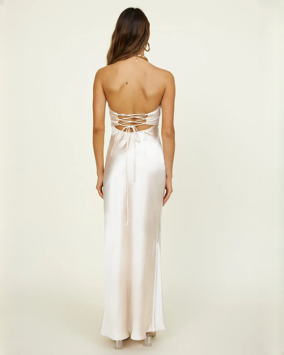 Ivory satin bridesmaid maxi dress, back view with lace-up straps and floor-length hem