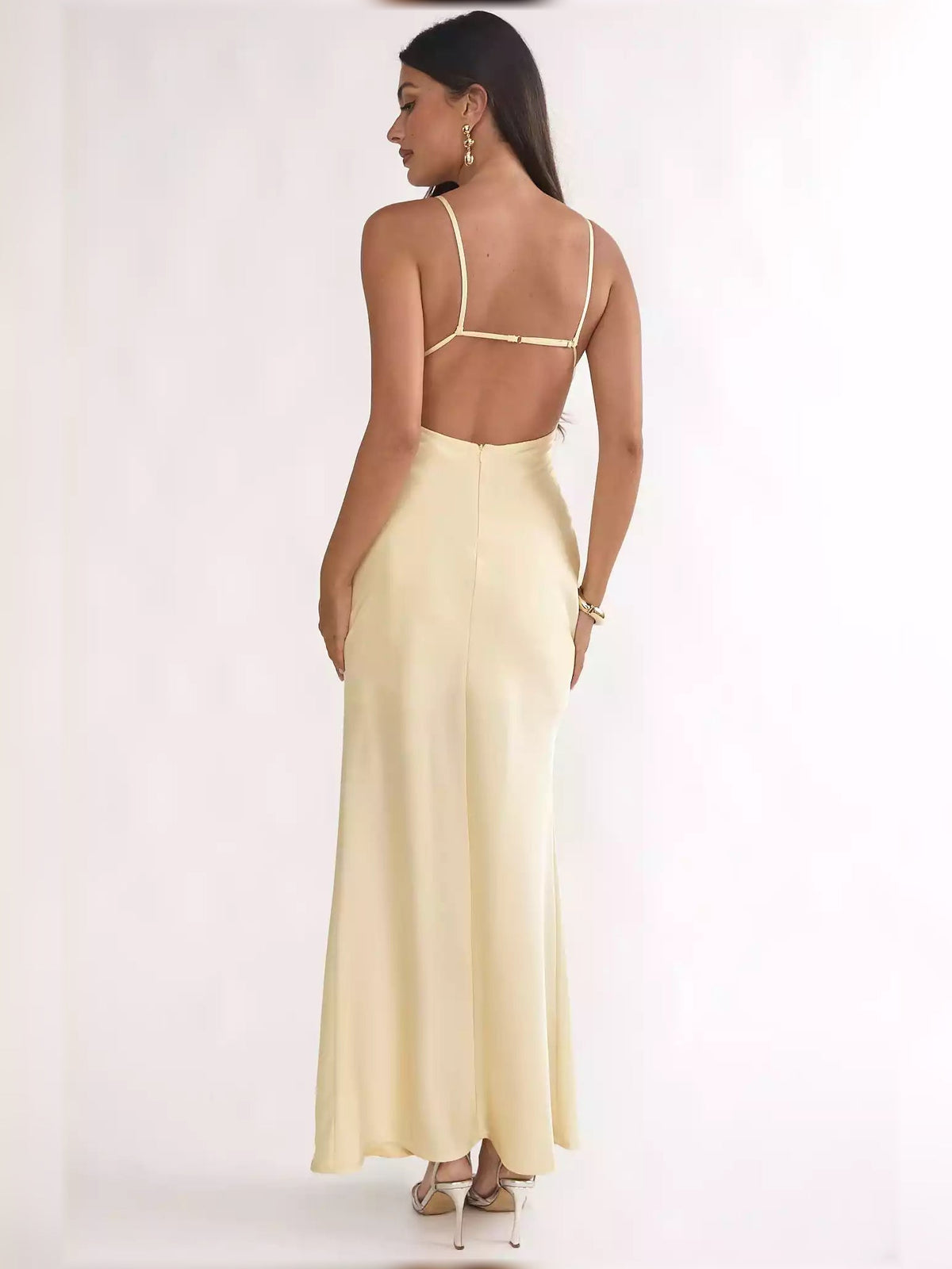 Pale lemon open-back formal dress with thin spaghetti straps and fitted skirt