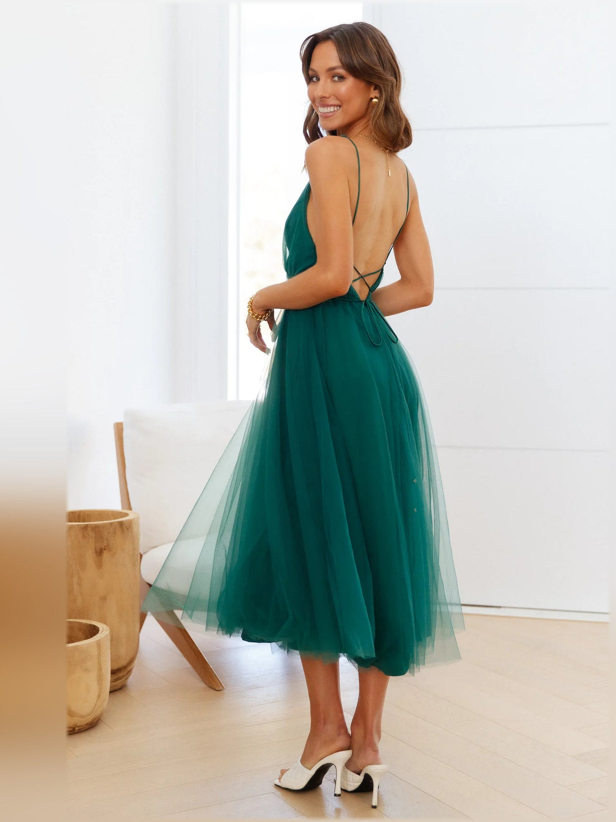 Forest green midi dress side view with halter V-neck and tulle skirt
