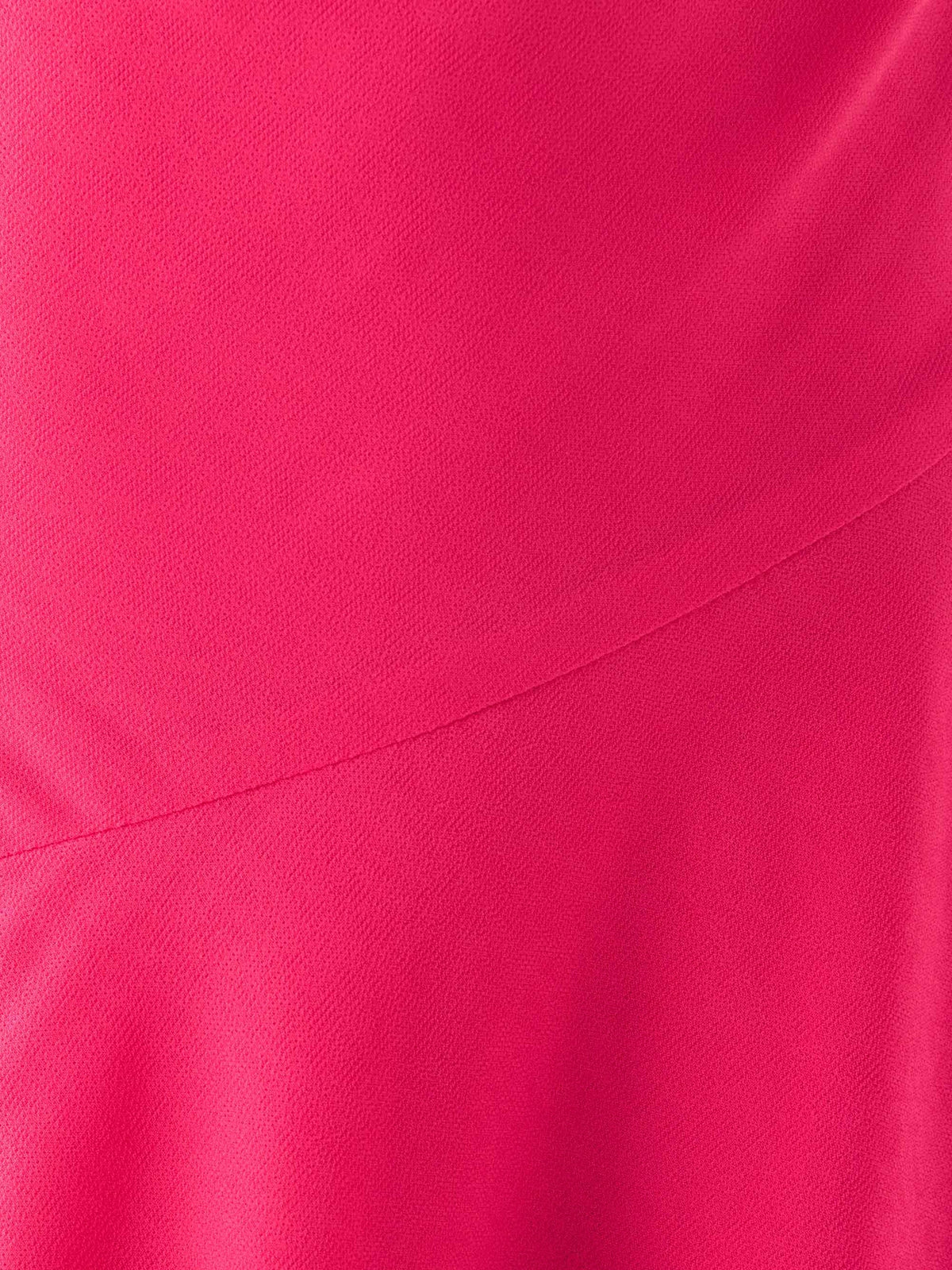 Fuchsia fabric close-up with smooth drape and stitched seam line