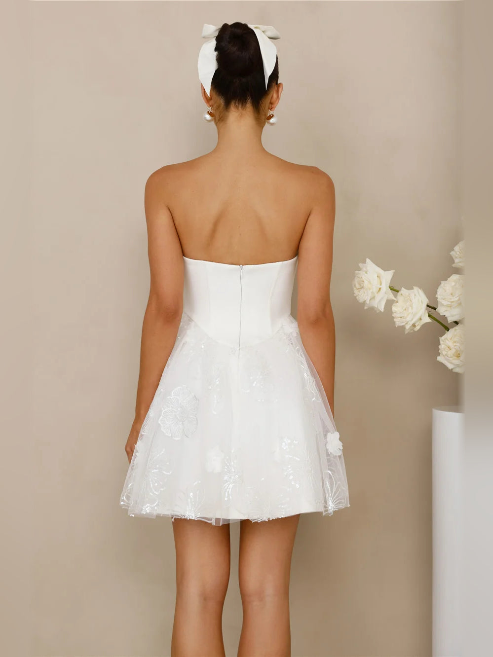 White strapless mini dress back view with scoop back and lace tulle skirt
