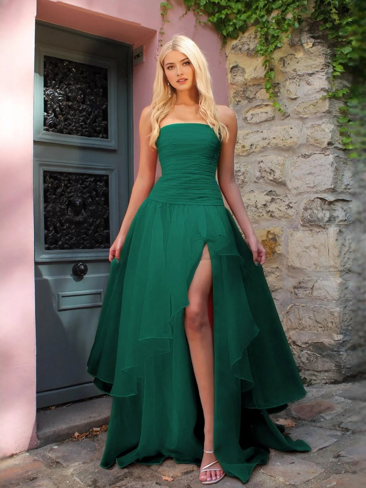 Emerald green strapless ruched prom dress with layered A-line skirt and front slit