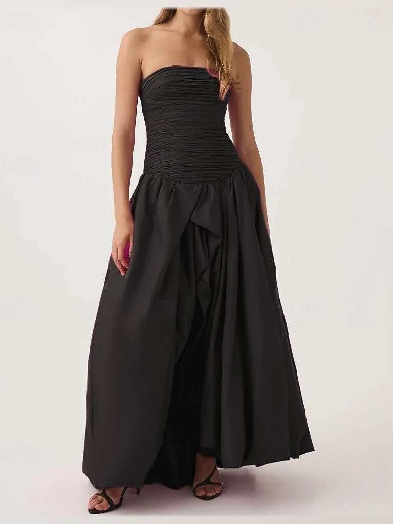 Black strapless maxi dress with ruched bodice and gathered A-line tiered skirt