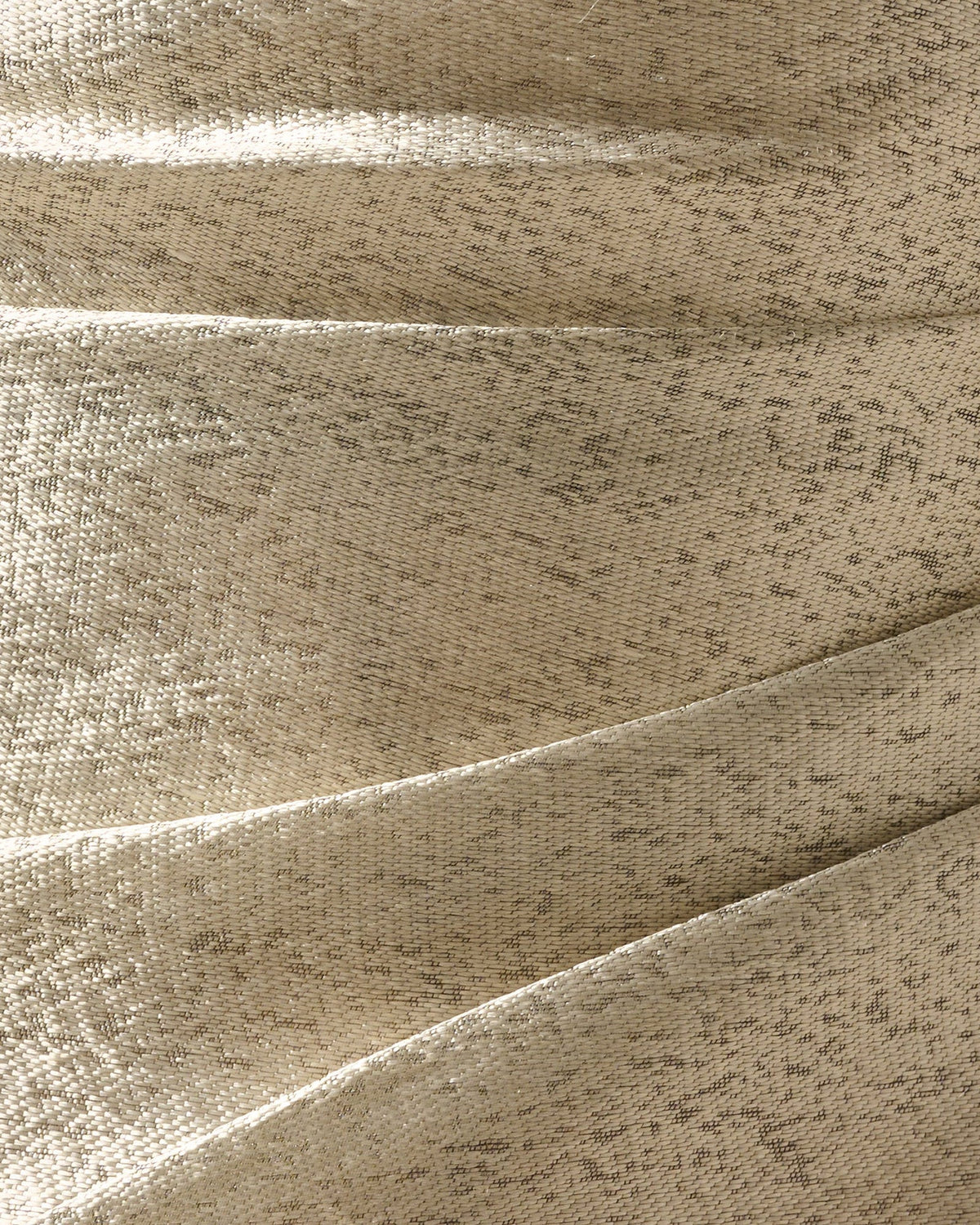 Light gold metallic fabric close-up with woven shimmer texture