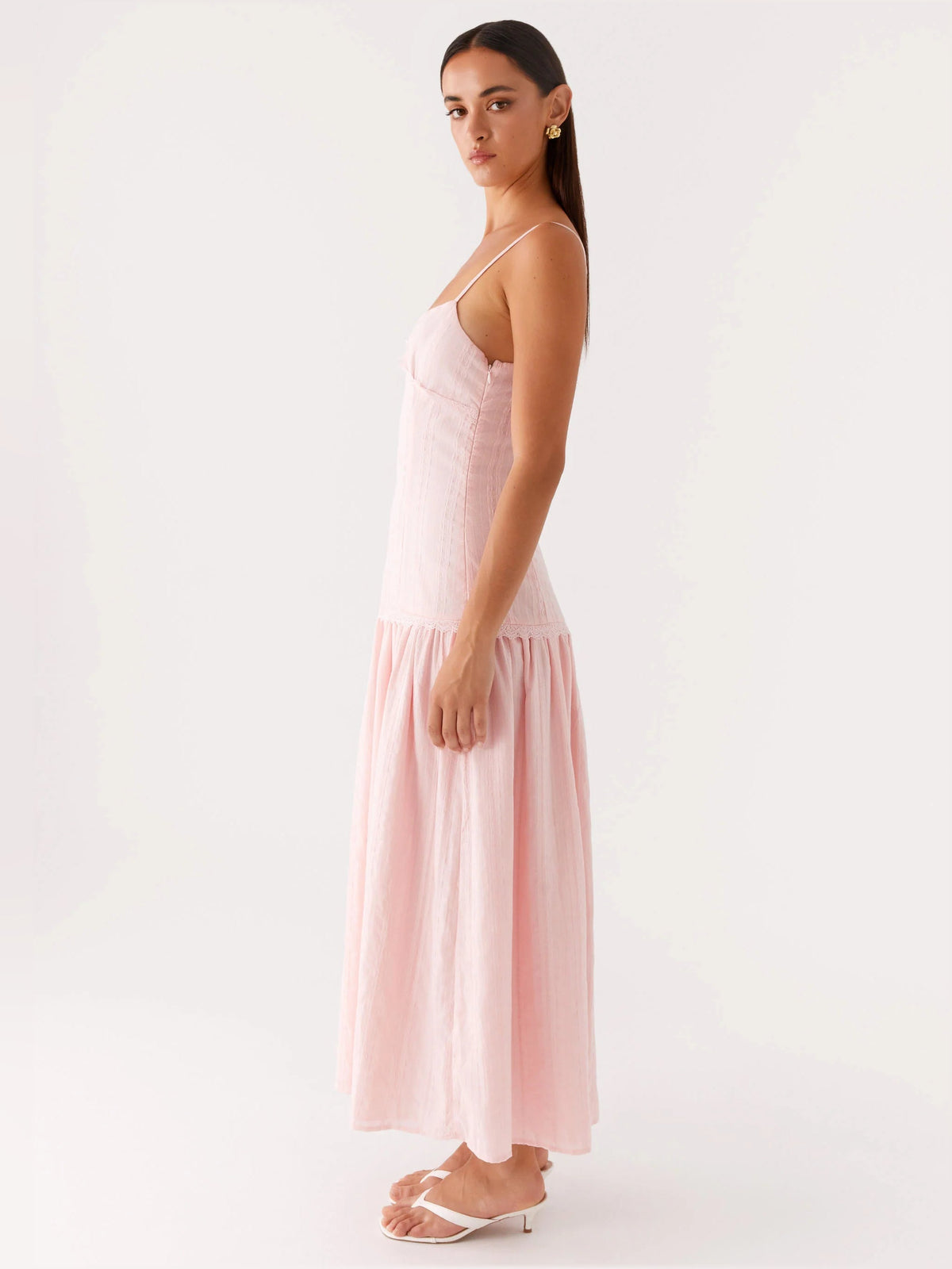 Pink midi formal dress side view with spaghetti straps and tiered skirt