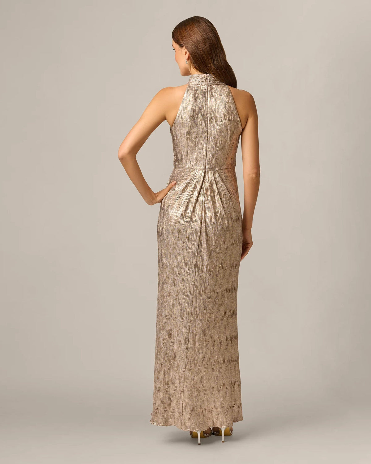 Rose-gold halter maxi dress back view with gathered waist and flowing skirt