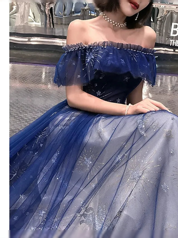 Dark navy off-shoulder tulle prom dress with star-like sparkle and soft, layered skirt tiers