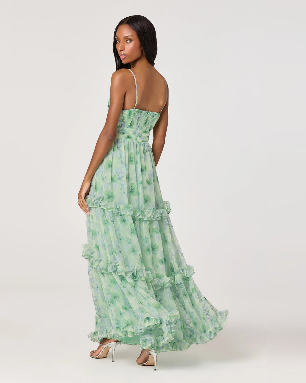 Green floral tiered maxi dress with spaghetti straps and layered ruffle hem