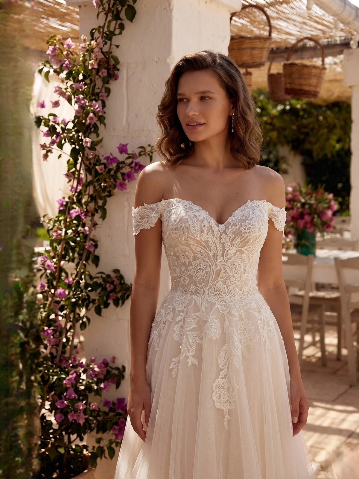 Ivory off-shoulder wedding dress with lace floral bodice, detailed tulle skirt