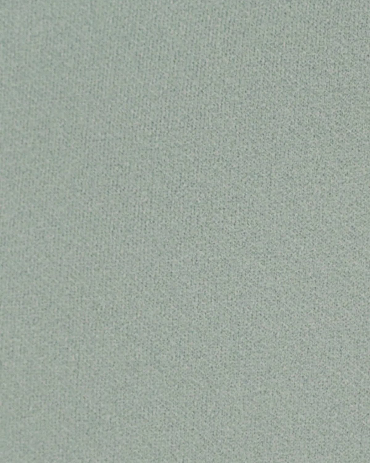 Close-up fabric texture in pale aqua, fine woven surface with subtle speckled finish.