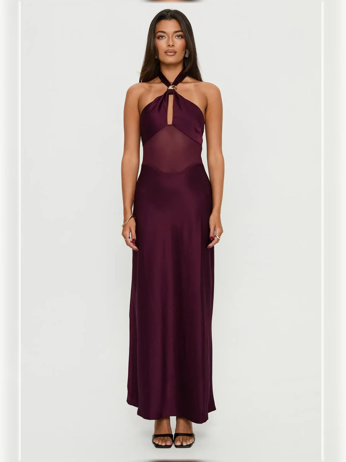 Plum halter neck formal dress with bow tie neckline and flowing floor-length skirt