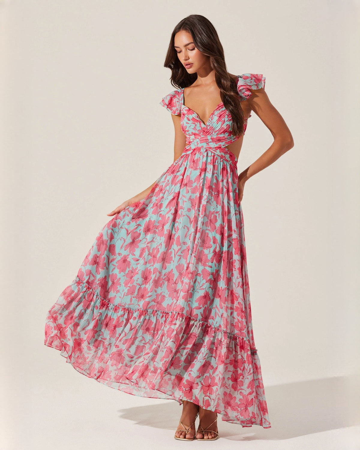 Sleeveless floral maxi dress with V-neck and tiered skirt, pink and teal print