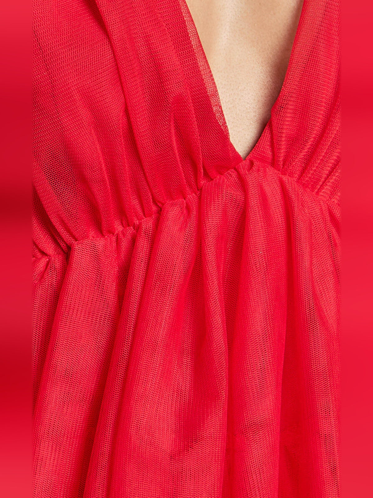 Close-up of red textured tulle bodice and gathered tiered ruffles