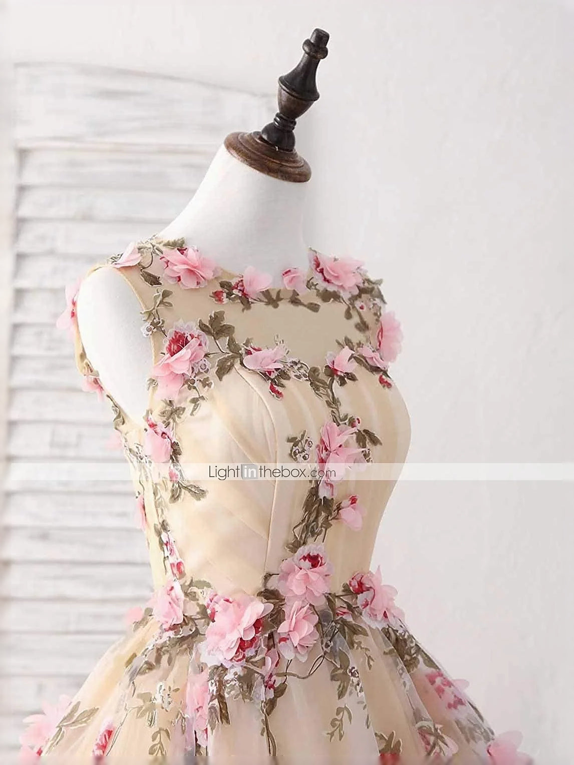 Pearl pink floral sleeveless midi tulle dress on mannequin, open-back detail