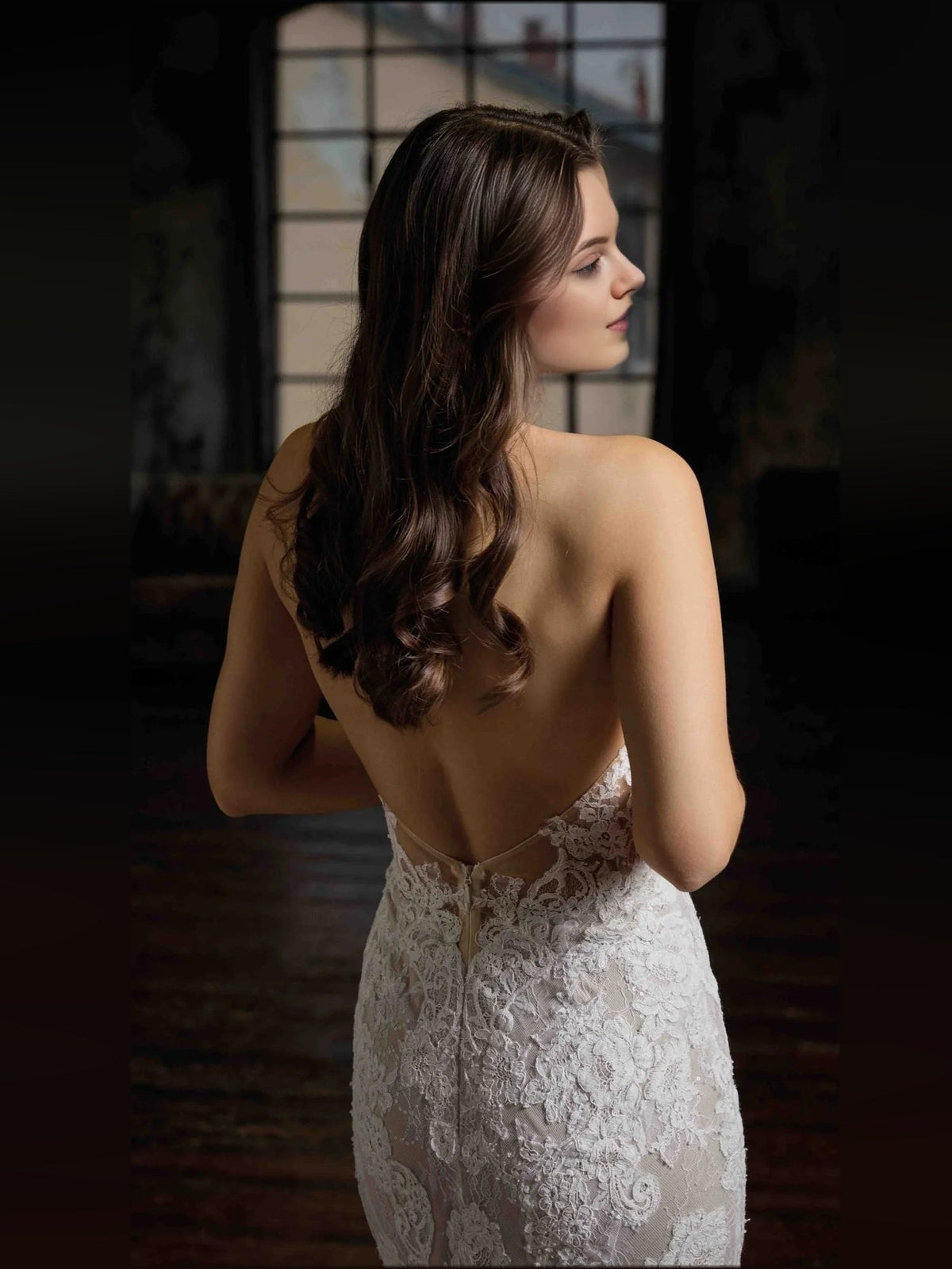 Ivory lace halter-neck wedding dress with low open back and fitted mermaid skirt