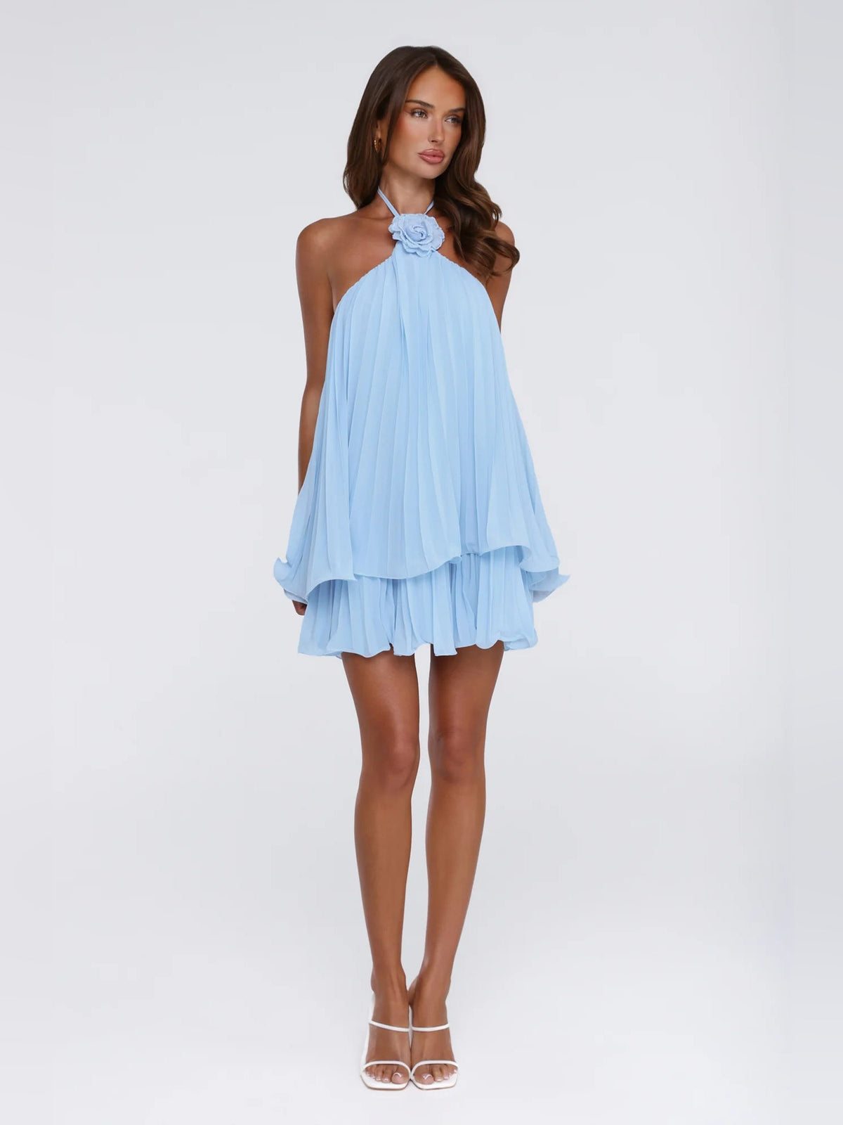 Light blue pleated halter neck mini dress with tiered ruffle layers and floral neck detail