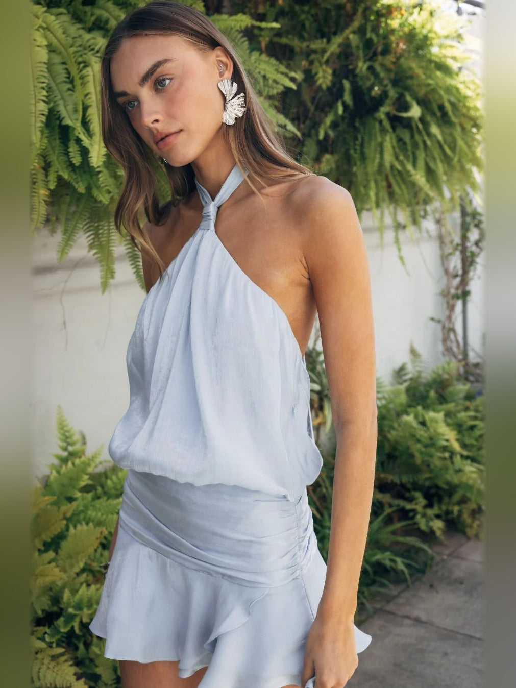 Light blue halter neck mini satin dress with keyhole tie and ruffled skirt