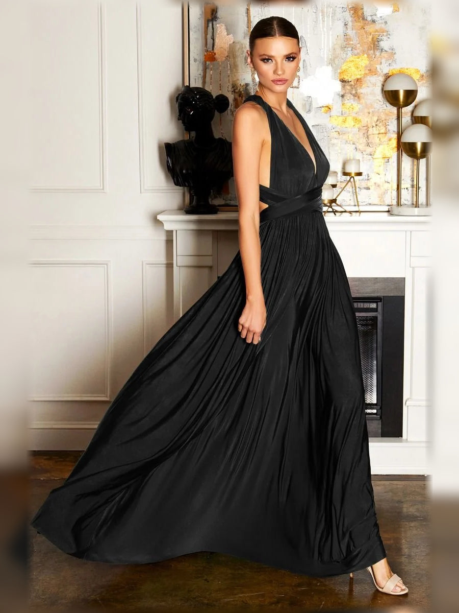 Black halter formal dress with ruched waist, draped strap, and pleated floor-length skirt