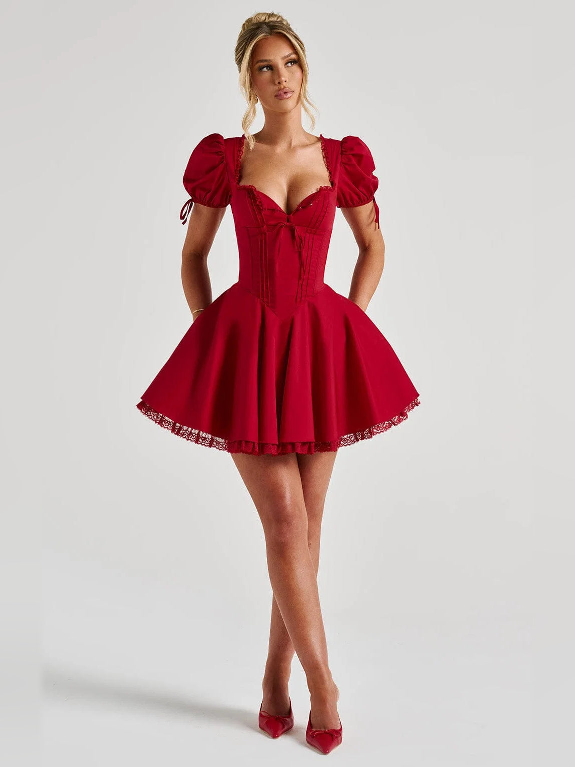 Red mini dress with puff sleeves, square neckline, corset bodice, flared skirt
