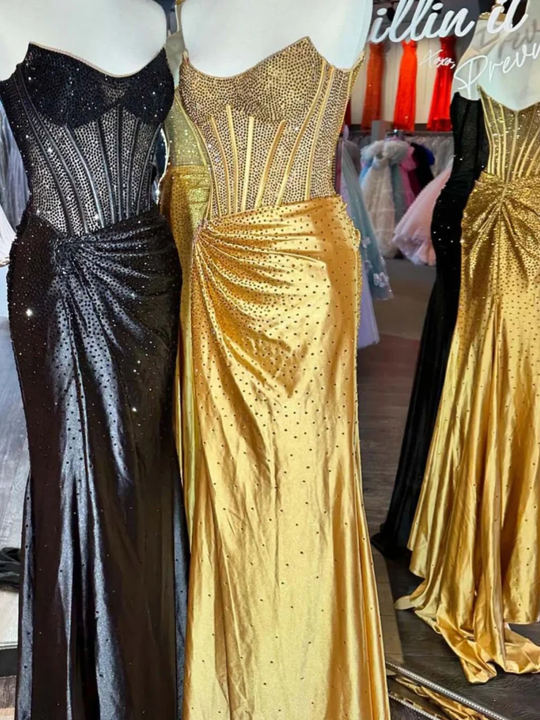 Gold sequin corset-style formal dress on a rack, sleeveless with sweetheart neckline