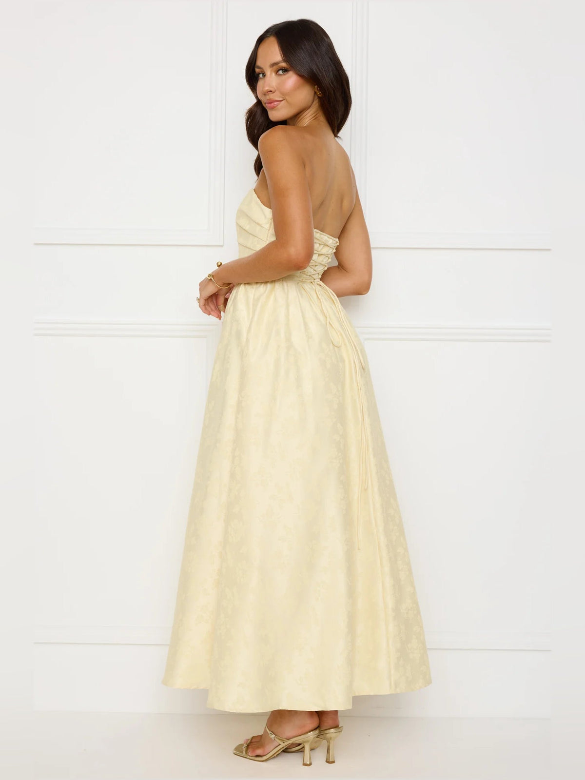 Yellow a-line maxi formal dress with strapless neckline, alternate view showing the hem