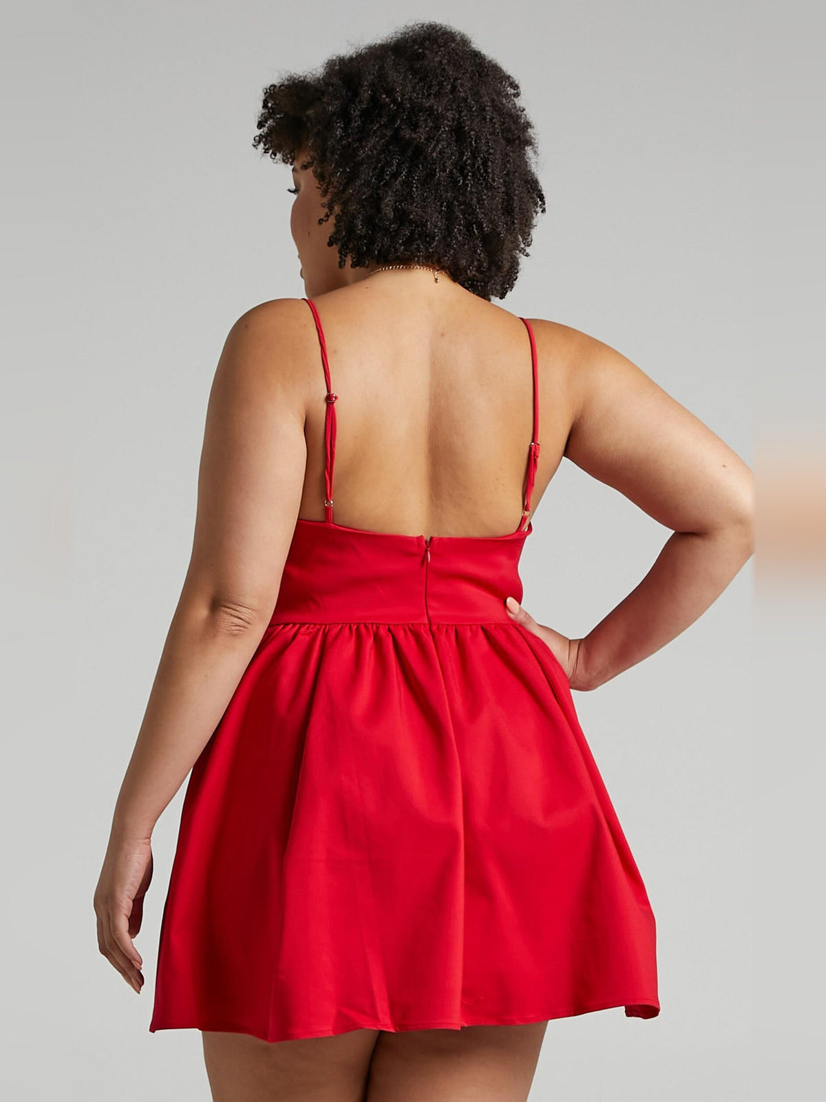Red A-line mini dress back view with spaghetti straps and gathered waist
