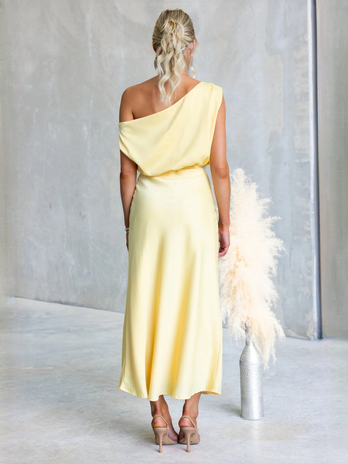 Black sheath maxi formal dress with draping, alternate full-length view showing the hem
