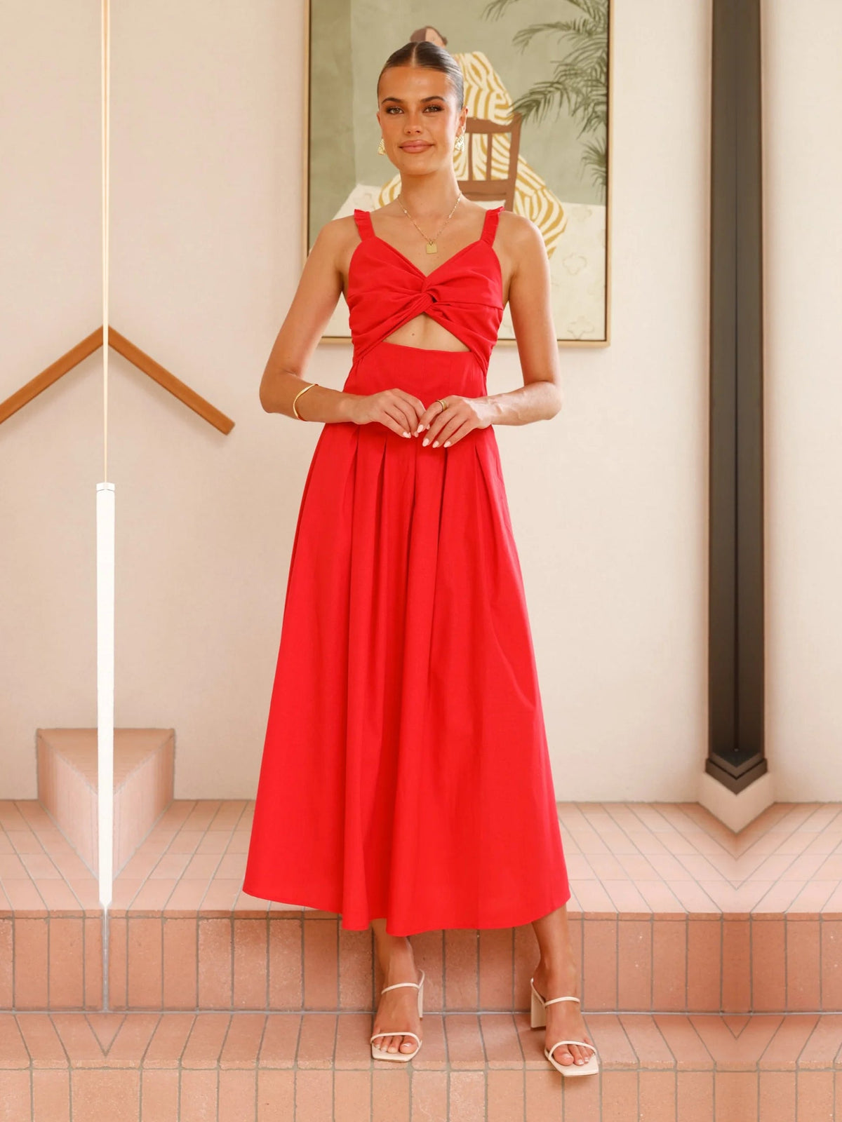 Red a-line maxi formal dress with cutout detail, alternate view showing the hem