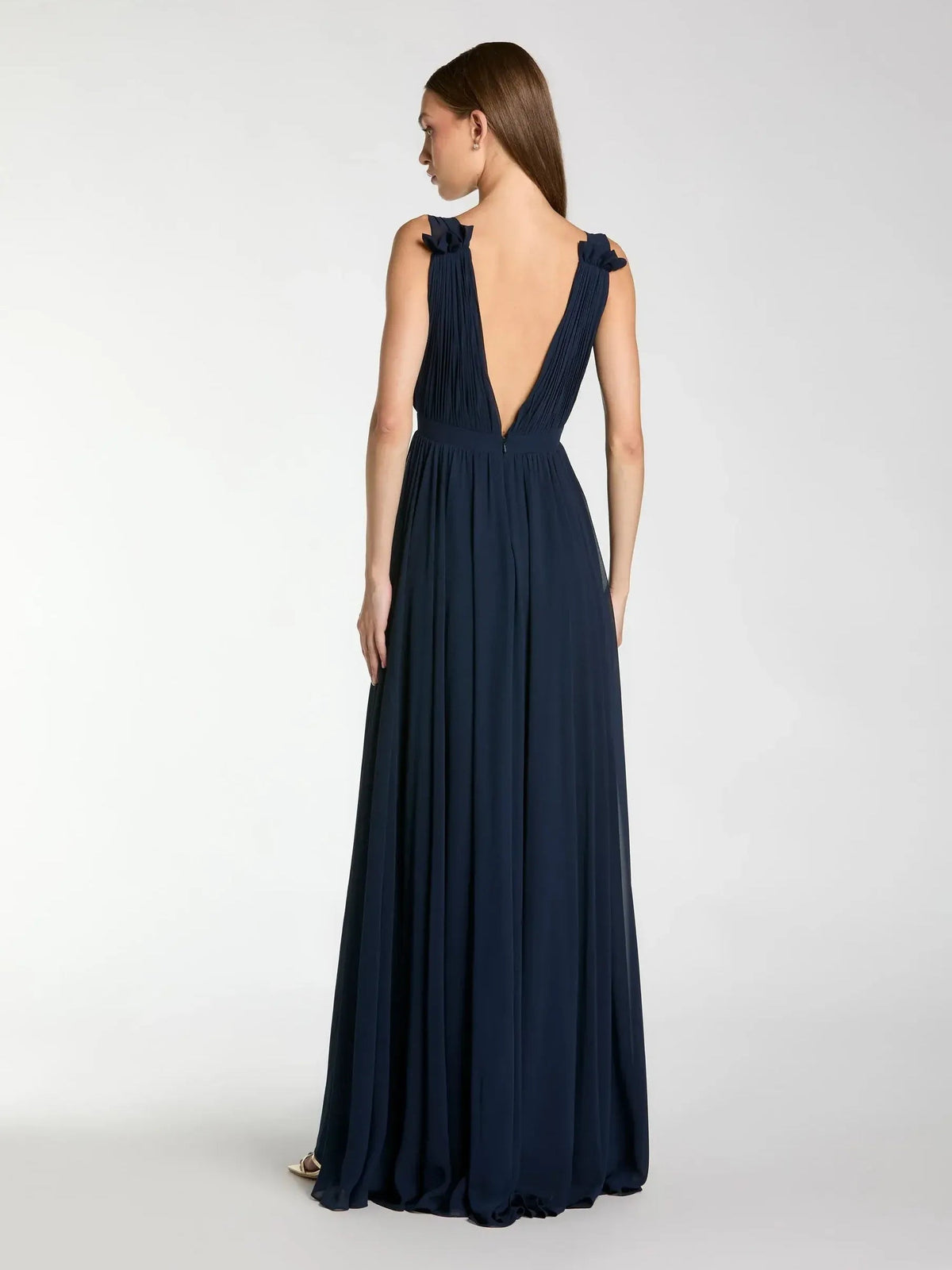 Dark navy V-neck formal maxi dress with open back and gathered shoulder ruffles