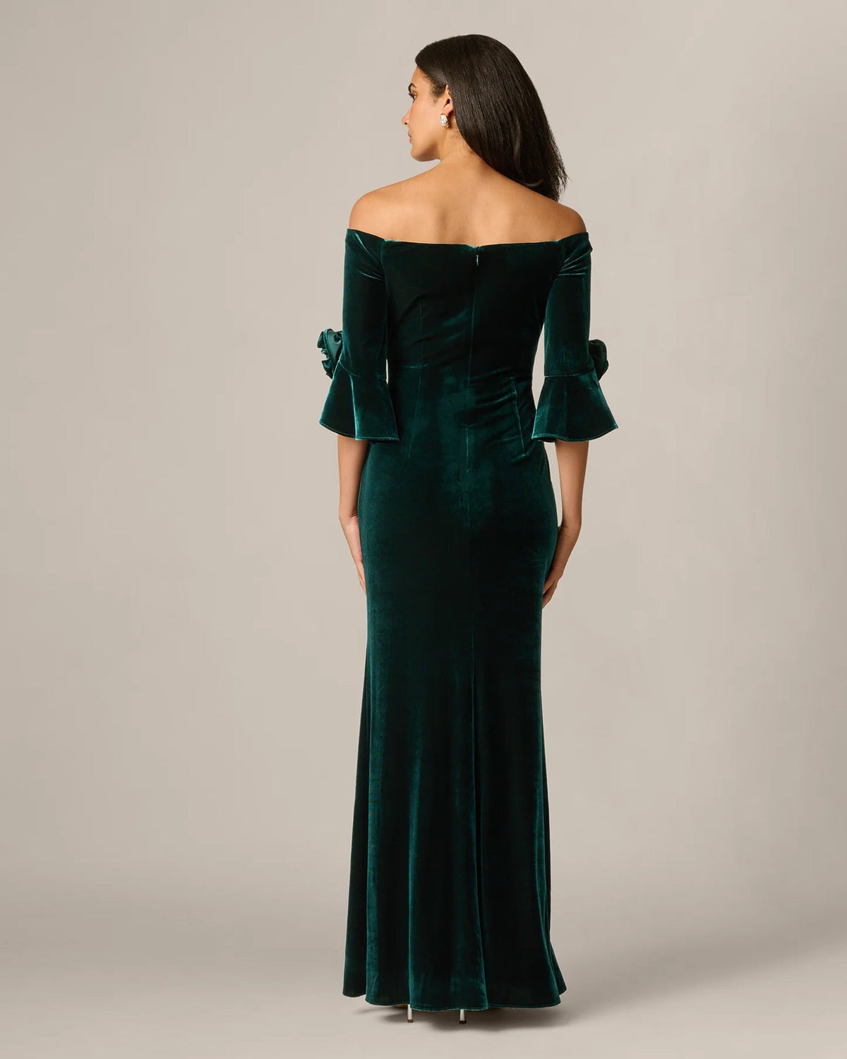 Hunter green off-shoulder maxi dress viewed from the back with rosette sleeve details