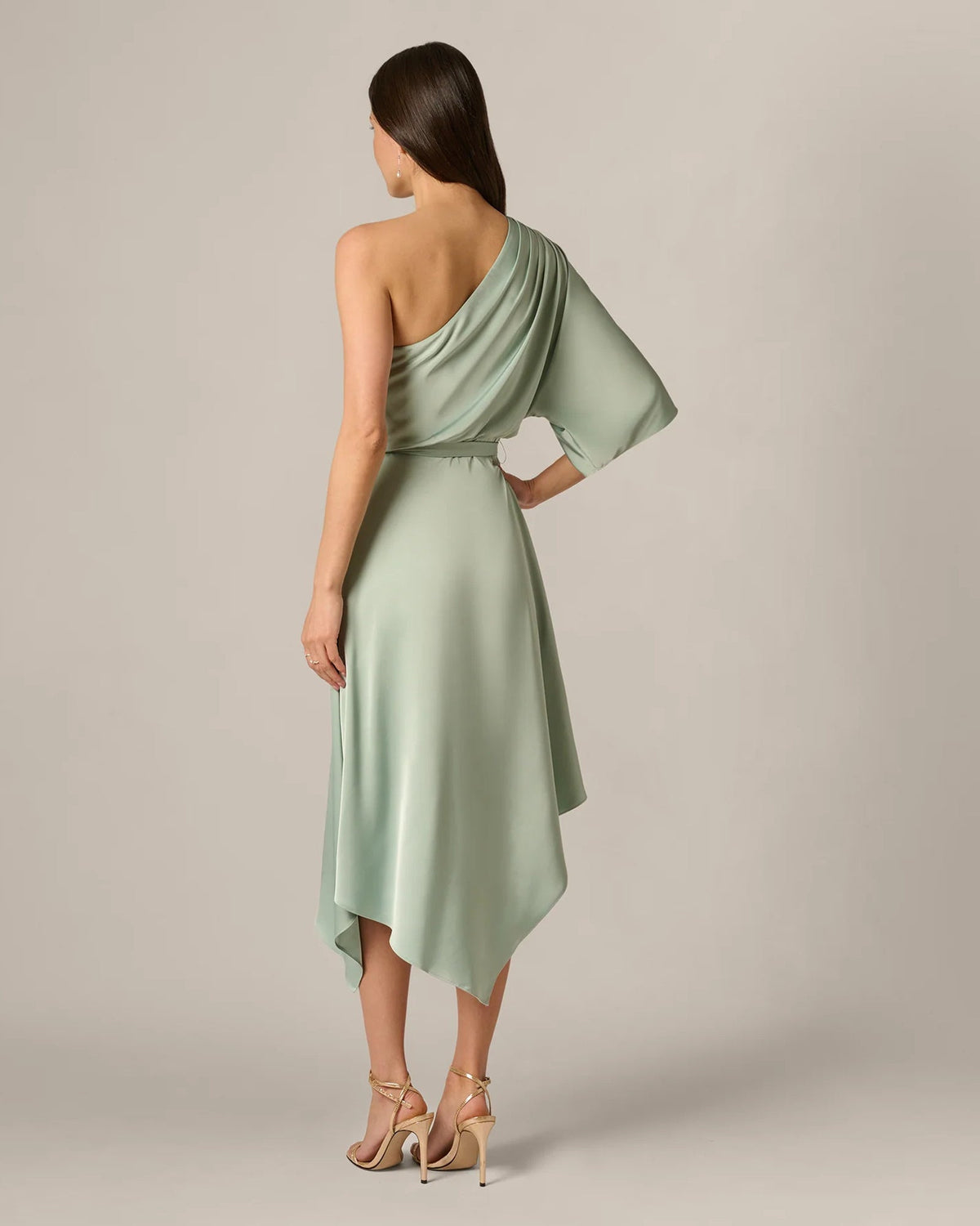 Mint green A-line midi dress from back, draped one-shoulder style with tie waist