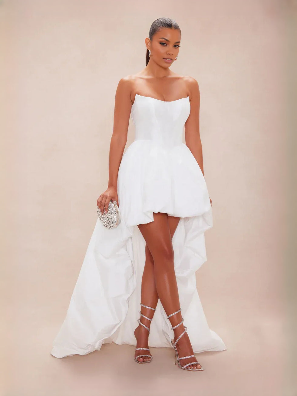 White strapless corset high-low A-line prom dress with draped, layered skirt