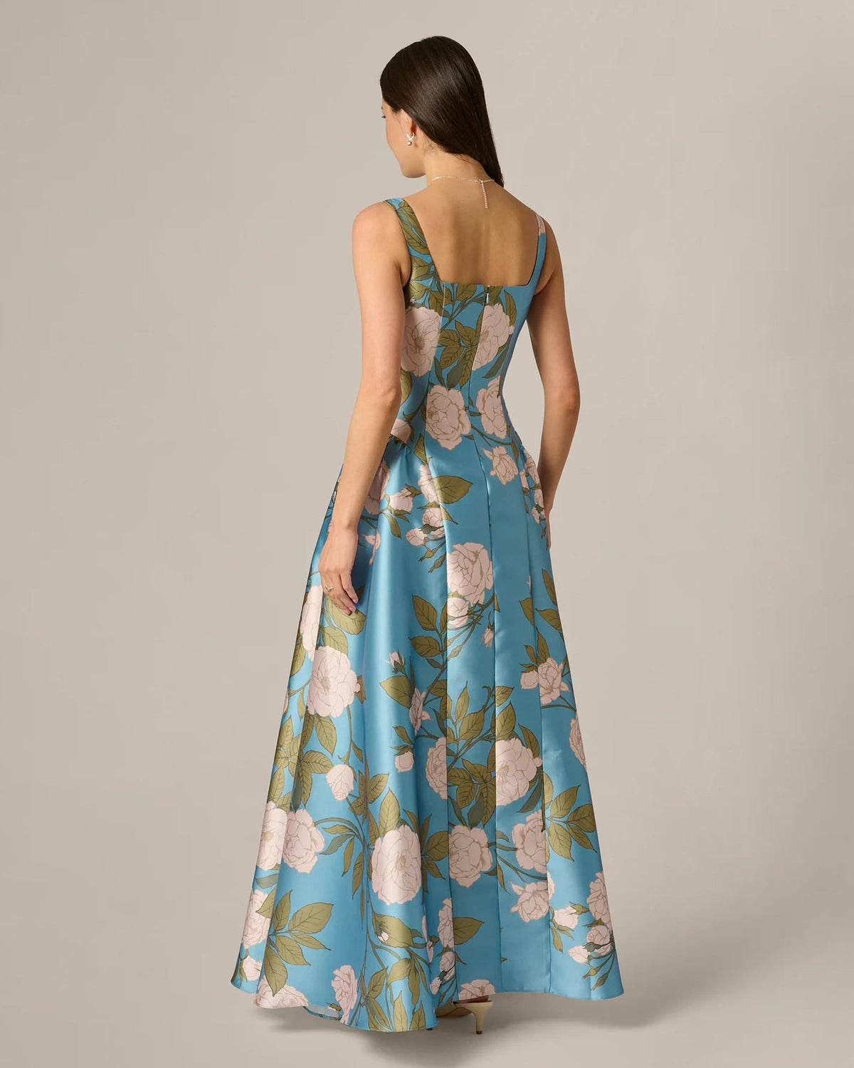 Back view of blue floral maxi A-line dress, sleeveless with square back neckline