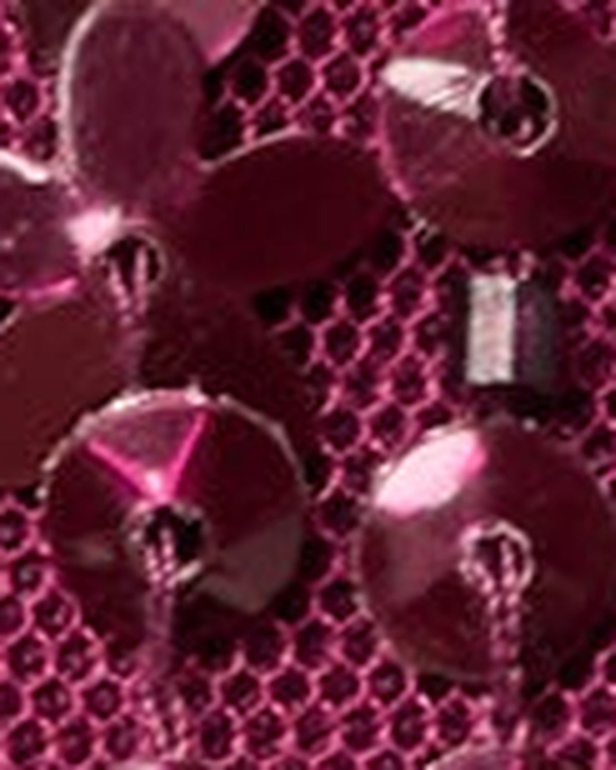 Close-up of Bordeaux sequin and bead embellishment on sheer fabric