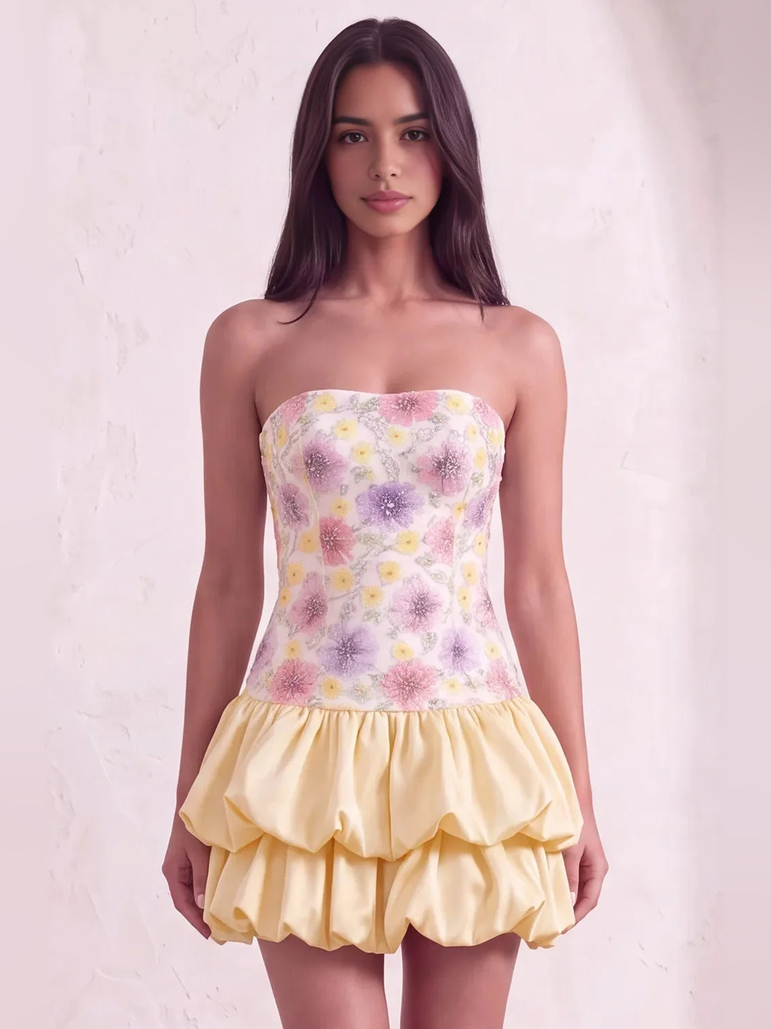 Light yellow strapless mini dress with floral corset bodice and layered ruffle skirt