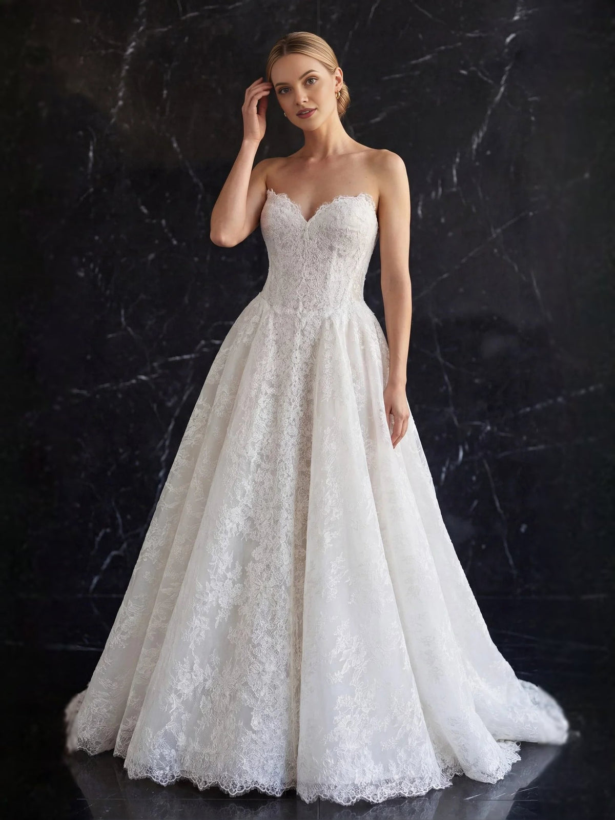 Ivory strapless tulle A-line wedding dress with sweetheart neckline and lace texture