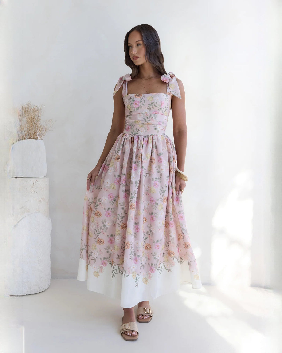 Pink floral sleeveless satin A-line maxi dress with gathered skirt and bow strap details