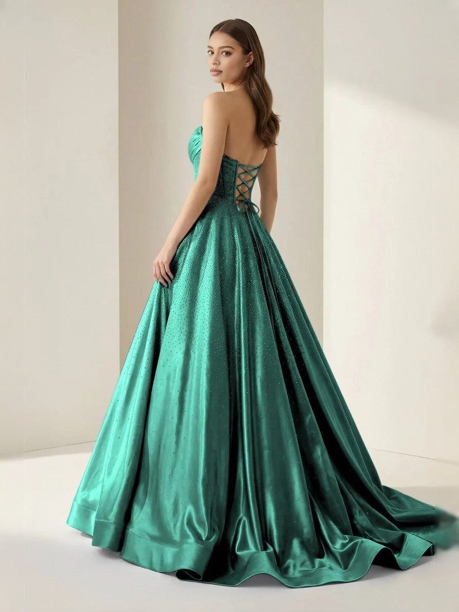 Emerald green strapless corset ball gown with gathered bodice and full skirt
