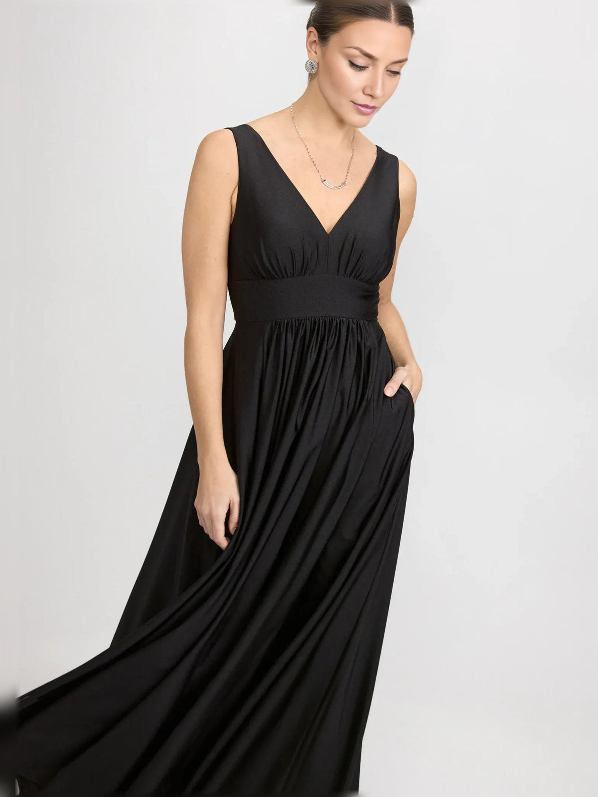 Black V-neck ruched floor-length formal dress with side slit, sleeveless gathered skirt