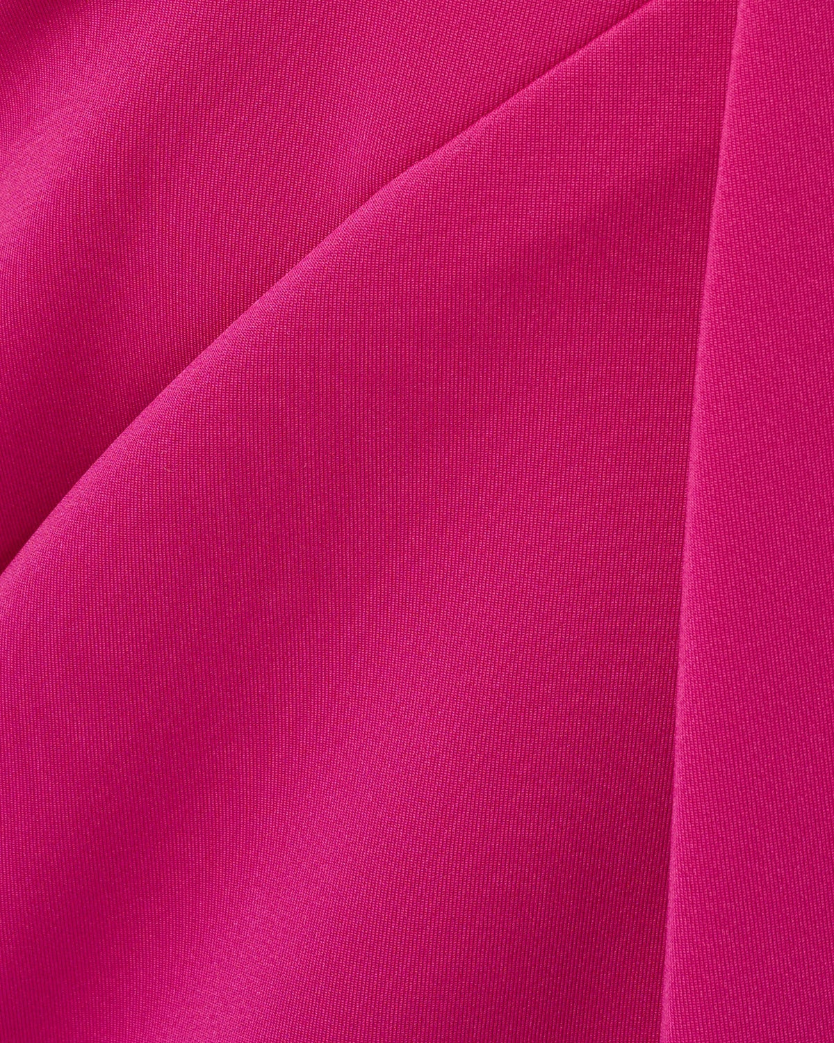 Hot orchid satin fabric close-up with smooth woven texture