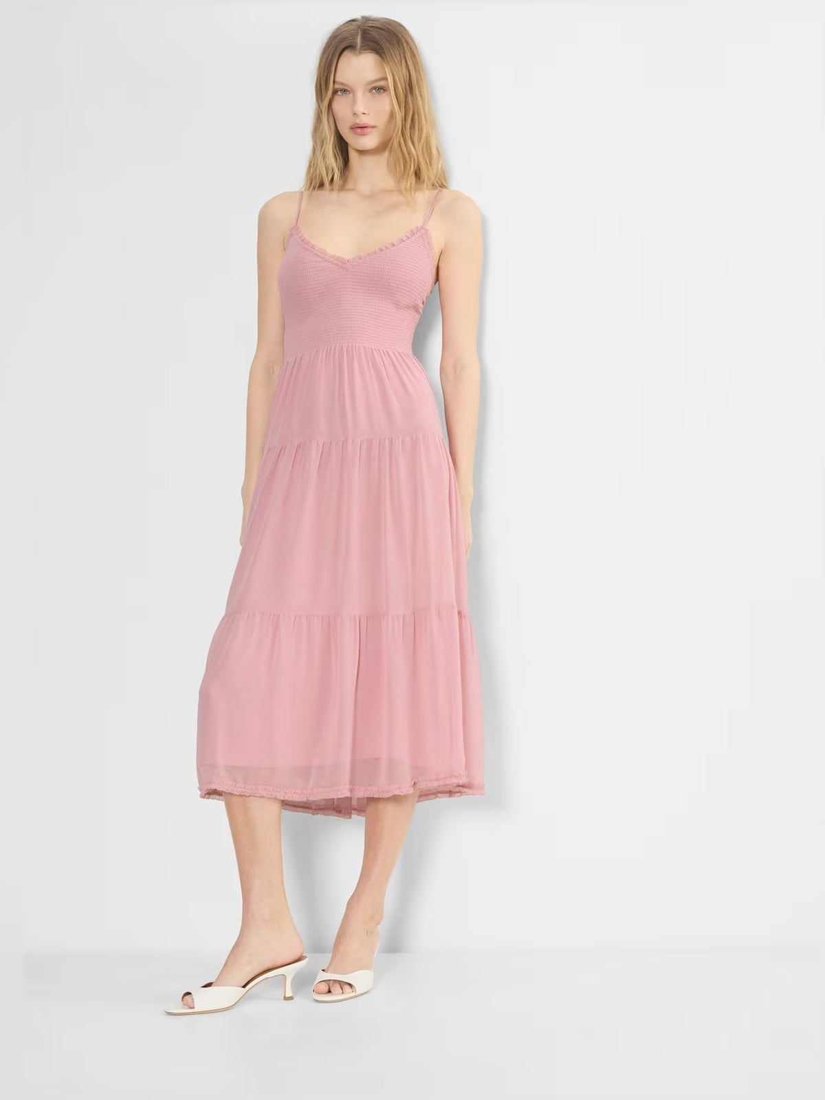 Pink chiffon midi formal dress with V-neckline, spaghetti straps, tiered flowing skirt