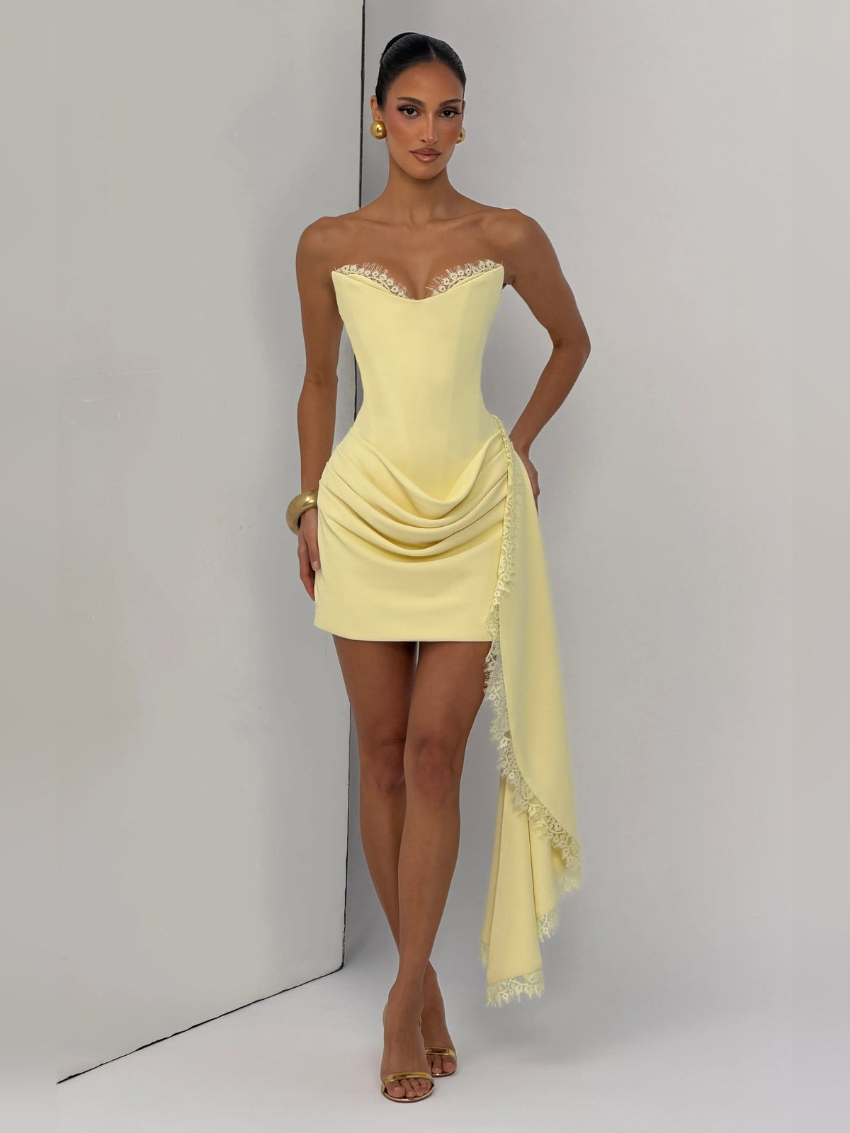 Lemon mini strapless dress with flowing lace-trim sash and side drape
