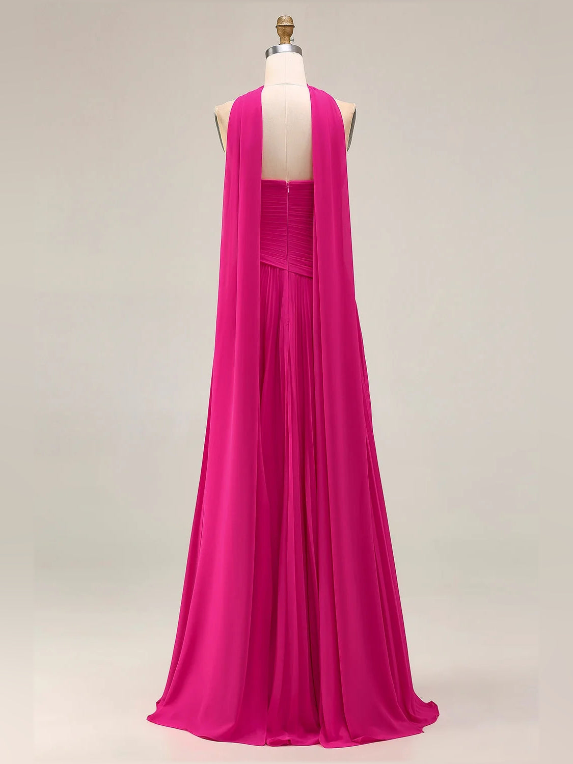 Fuchsia strapless A-line maxi prom dress on mannequin with draped back