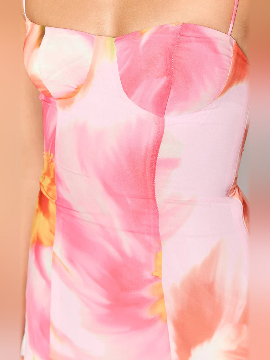 Pink floral mini dress bodice close-up, smooth fabric with princess-seam details